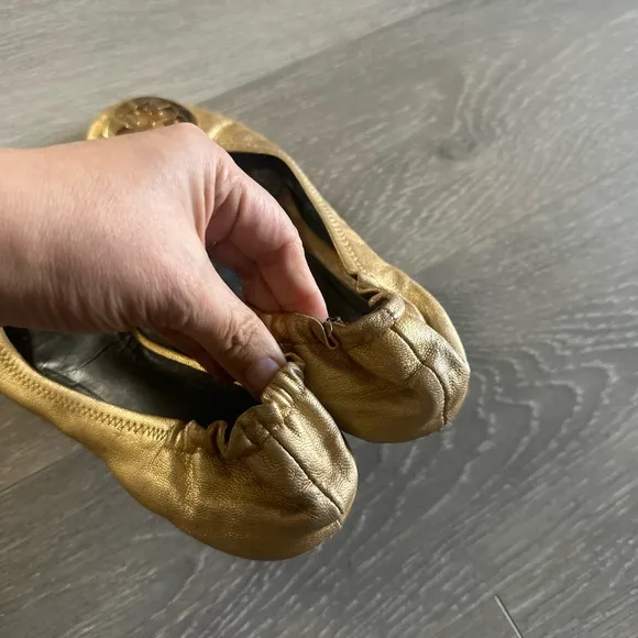 Tory Burch gold flats